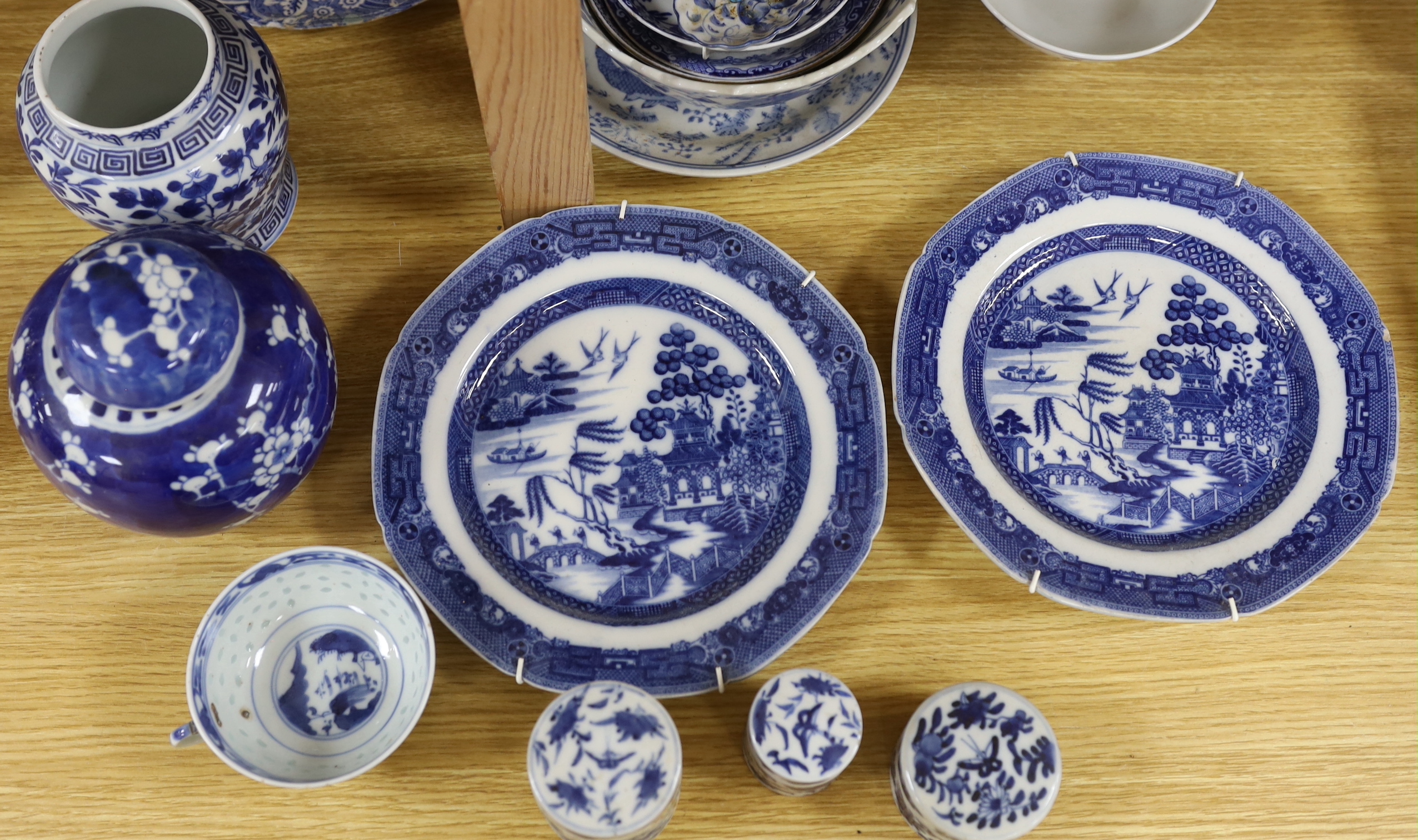 A collection of Chinese and Japanese blue and white jars, export plates and pots, together with European blue and white mixed tea wares